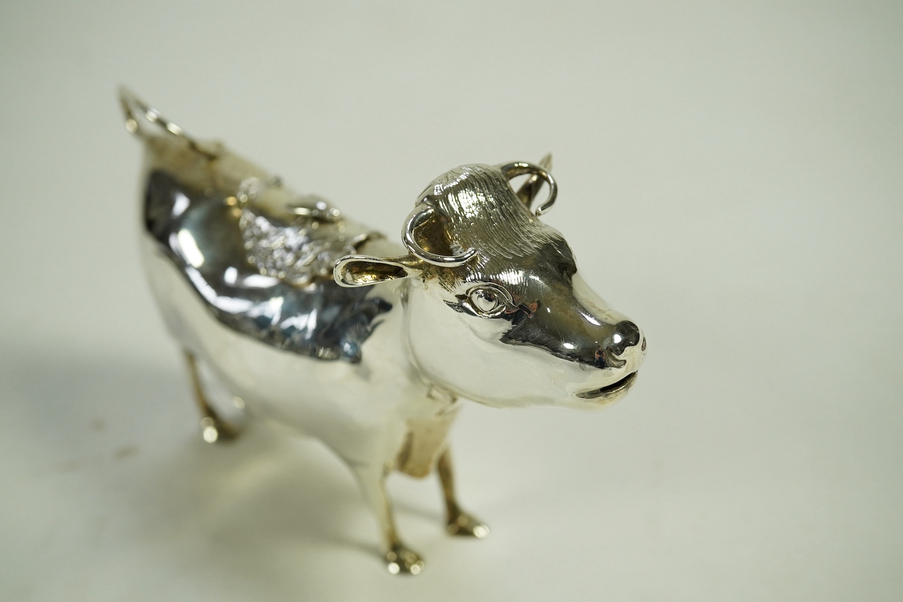 An Elizabeth II silver cow creamer by William Comyns & Sons Ltd